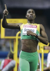 Caster Semenya of South Africa celebrates after she won in the women's 800 metres final during the world athletics championships at the Olympic stadium in Berlin, August 19, 2009. REUTERS/Michael Dalder (GERMANY SPORT ATHLETICS)   BEST QUALITY AVAILABLE